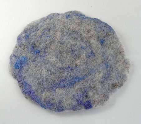 Hand felted coaster, 'Pebble and Shell', made in Scotland with wool from the Isle of Tiree