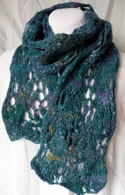 Handspun, handknit chunky lacy scarf in the deep blue-greens of the ocean, made in Scotland
