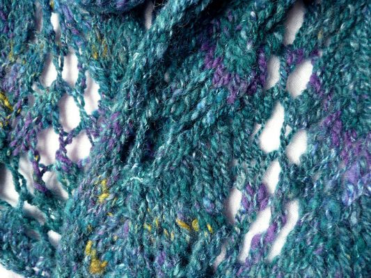 Handspun, handknit chunky lacy scarf in the deep blue-greens of the ocean, made in Scotland